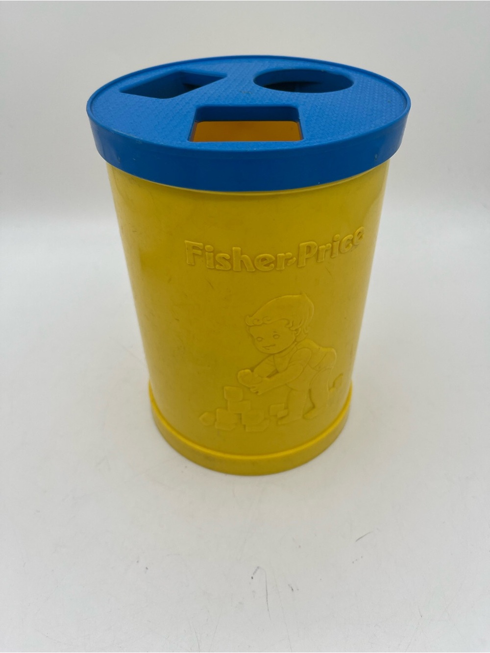 Vintage Fisher-Price Yellow Cylinder Shape Sorter with Blue Lid
